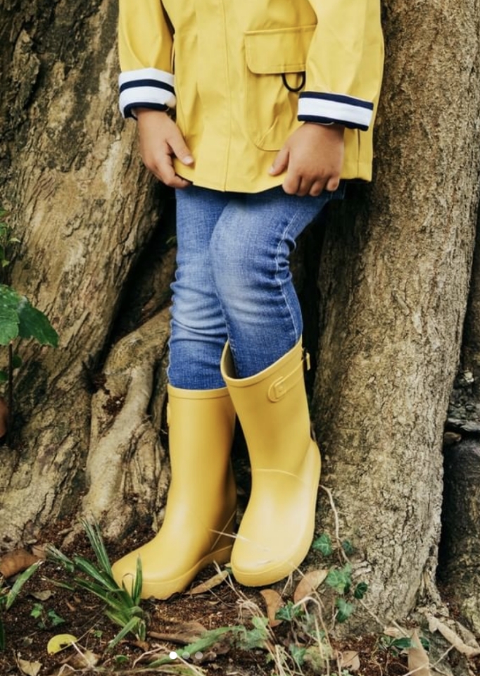 a child with yellow boots.