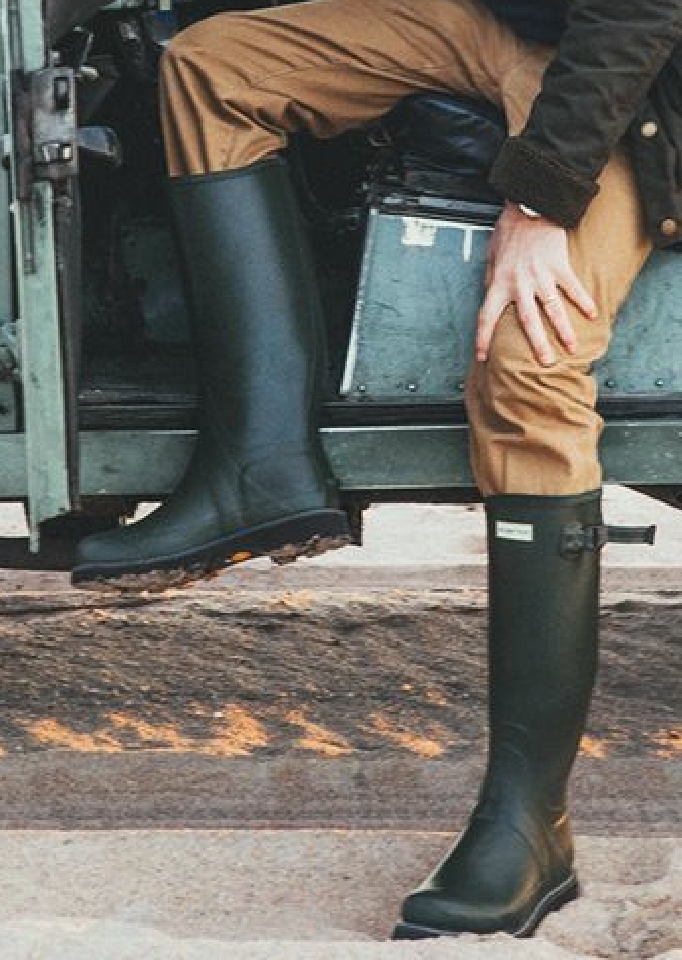 men legs with black boots.
