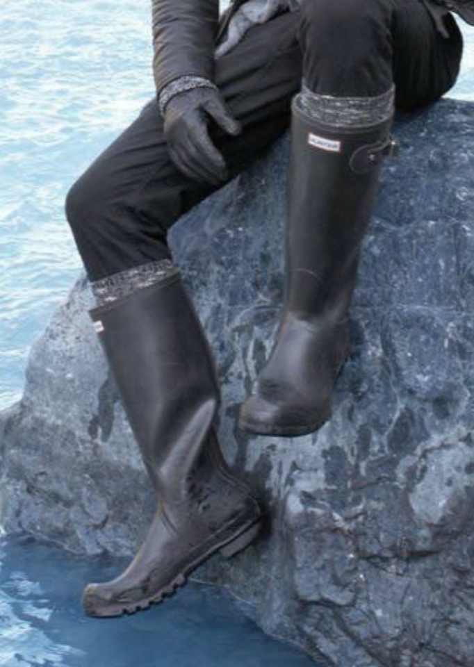men legs with black safety boots.